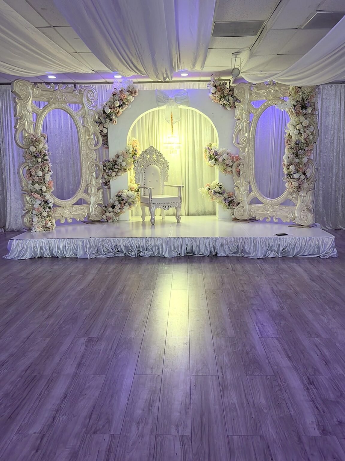Quinceañera throne and floral arch staged in the 5959 West ballroom, Orlando FL